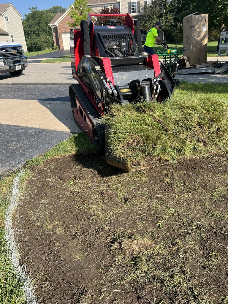 Removing grass from the side yard garden 